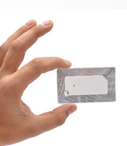 Hand holding small microchip