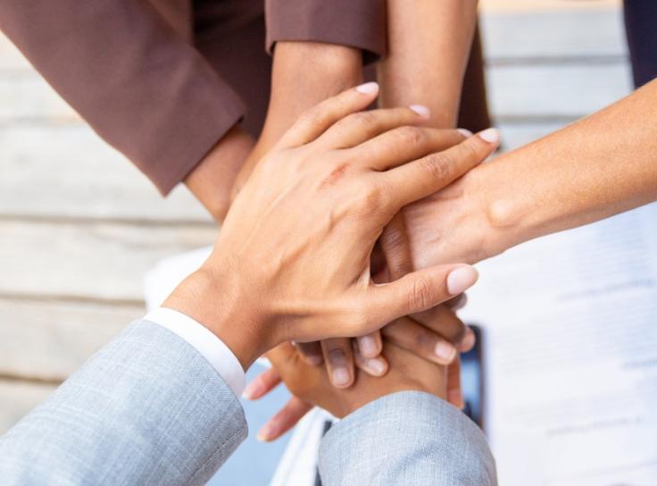 Hands piled on top of each other